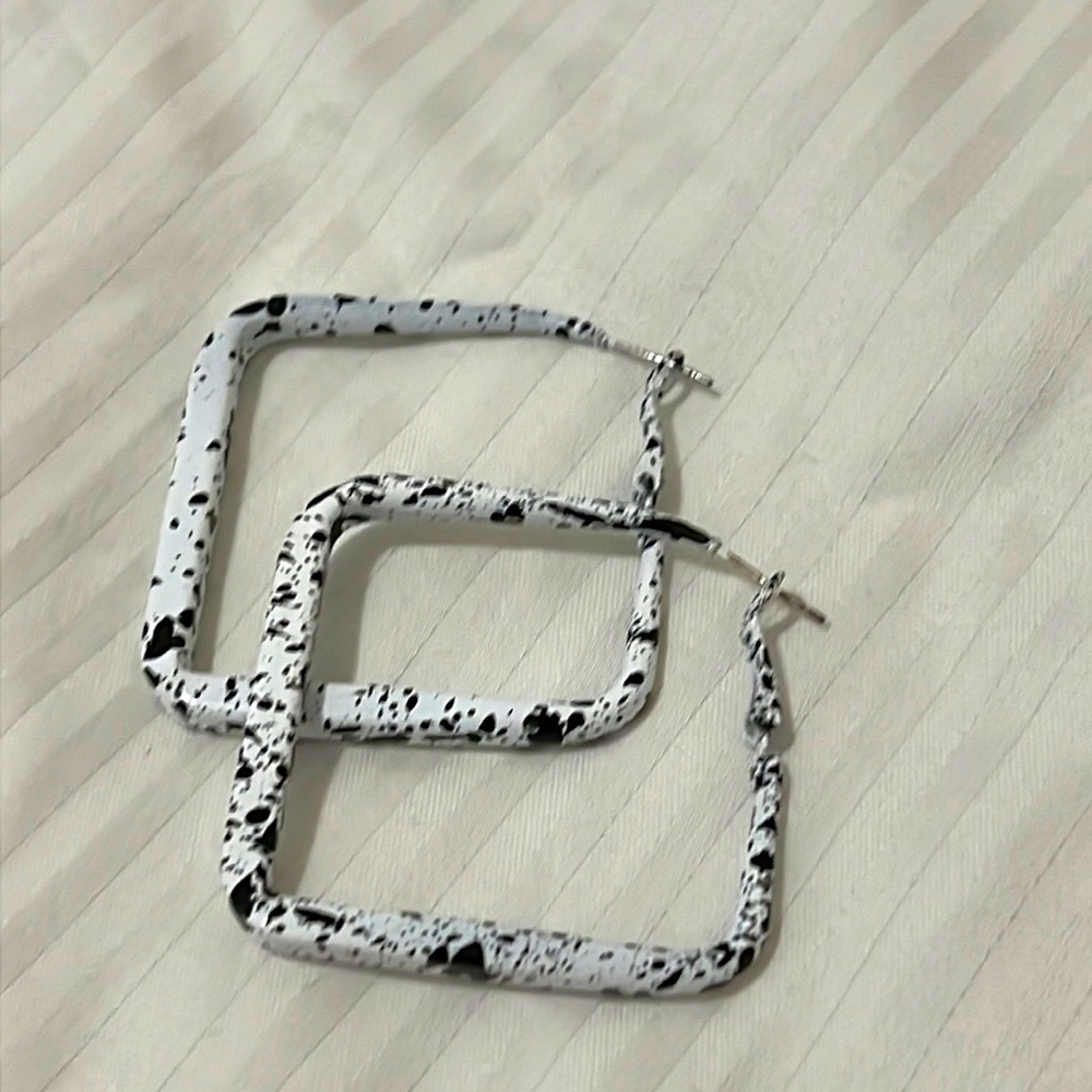 Black paint spotted earrings
